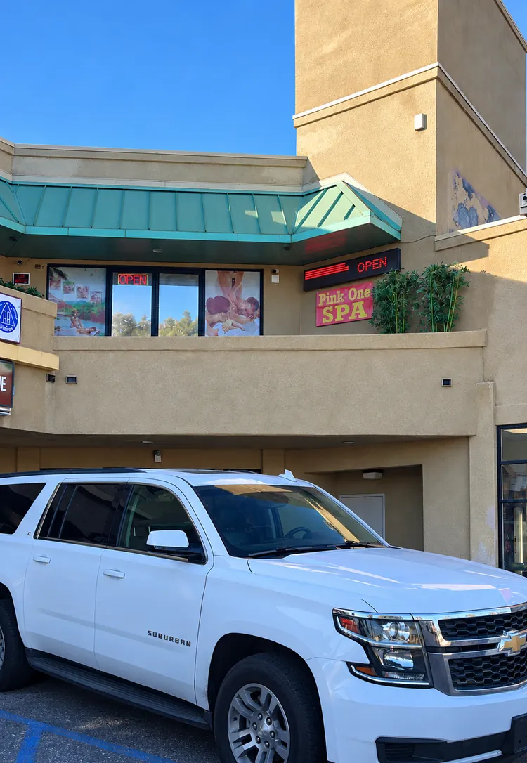 Building with the Pink One SPA sign, seen from the parking lot at 688 Hollister St #D, San Diego, CA